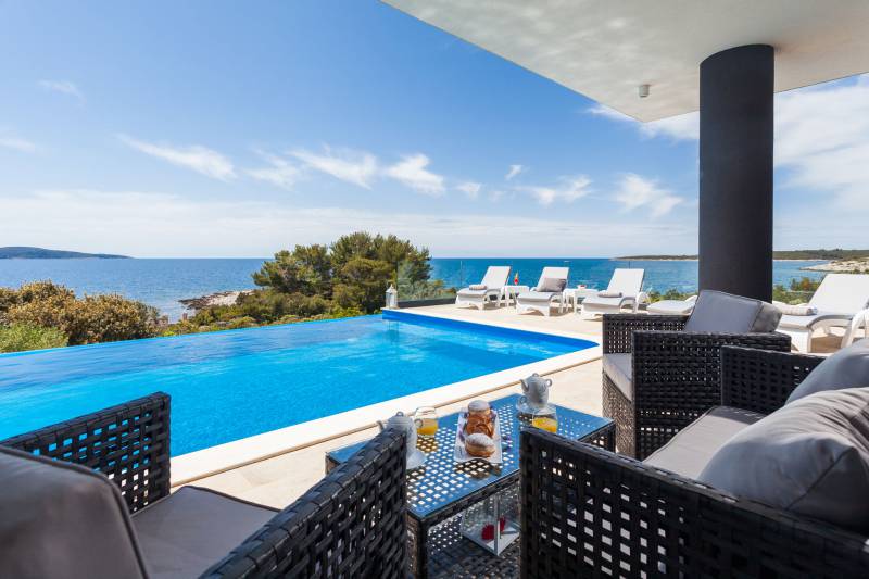 Beautiful sea view from terrace and infinity pool of Beachfront Villa Modena