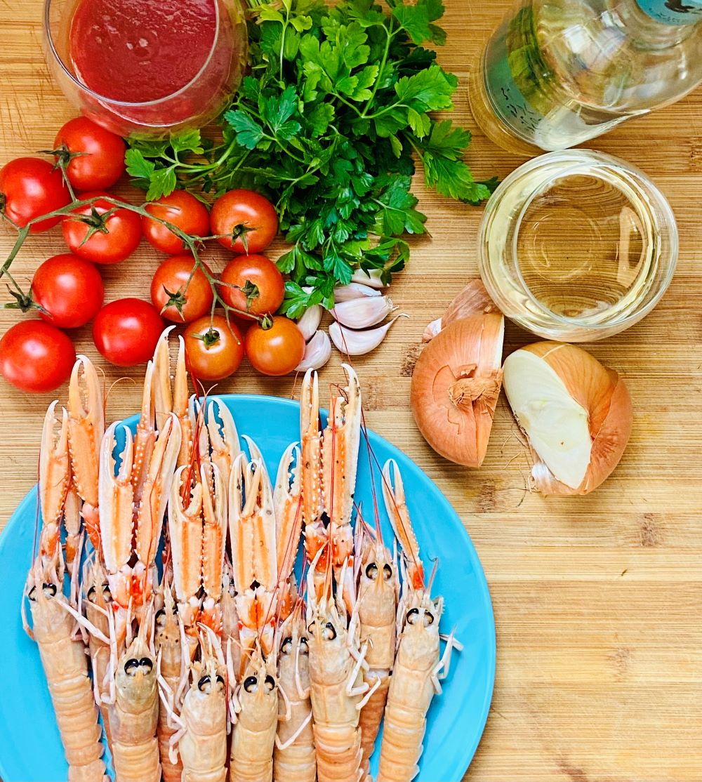 Ingredients for a seafood dish Scampi on Buzara